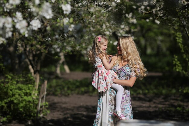 Mother and daughter in the garden