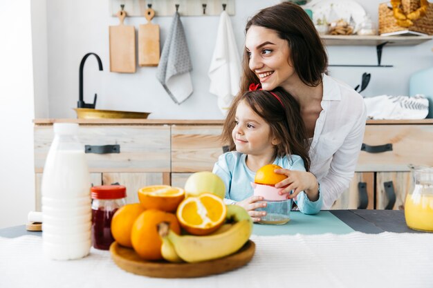 Mother and daughter having breakfast