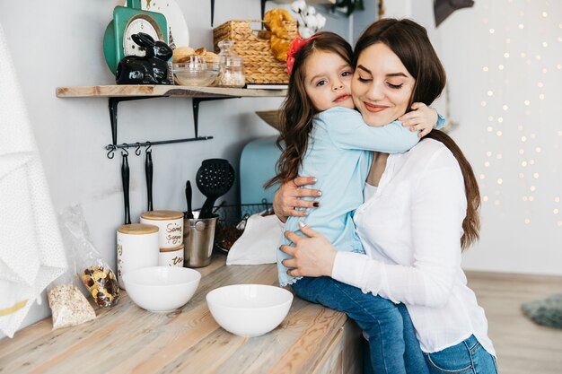 Mother and daughter having breakfast