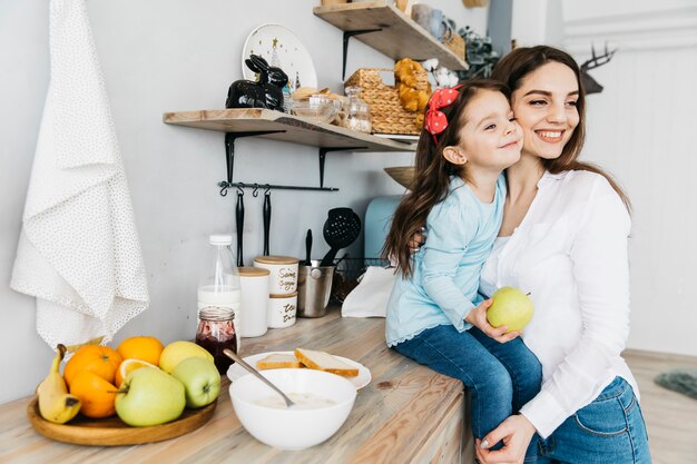 Mother and daughter having breakfast