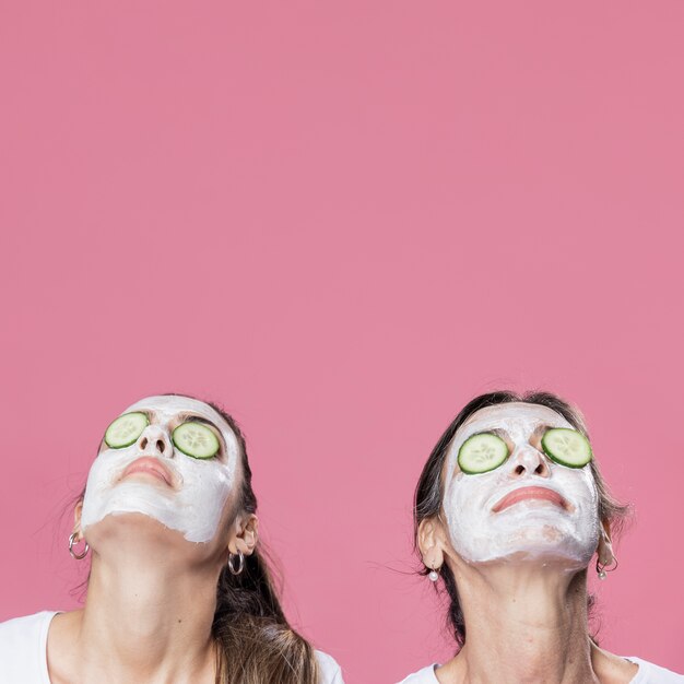 Mother and daughter having face mask