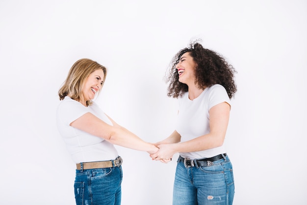 Mother and daughter holding hands 