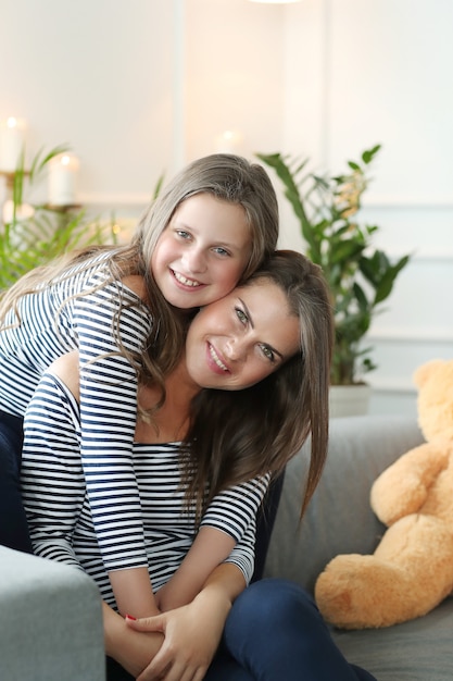 Free photo mother and daughter at home