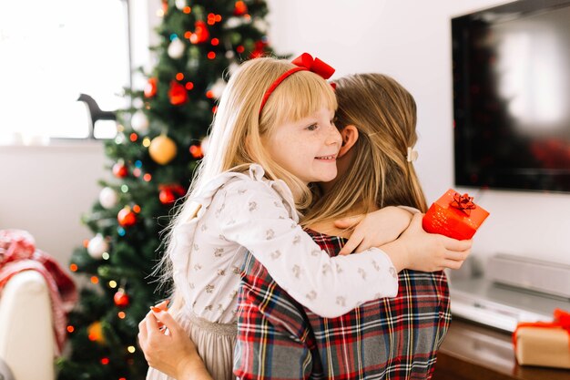 Mother and daughter hugging