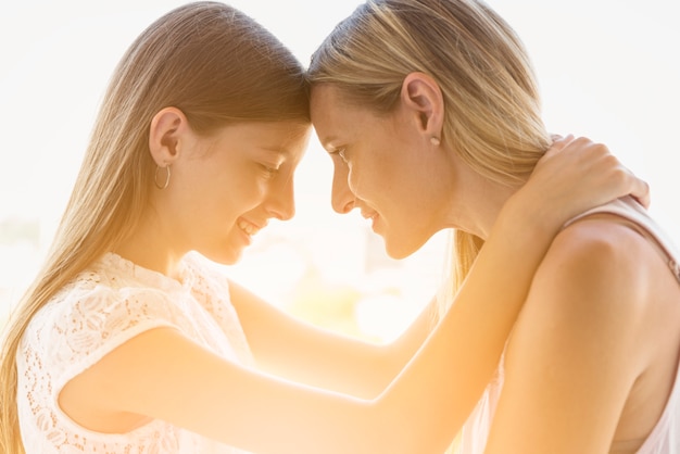 Free photo mother and daughter hugging