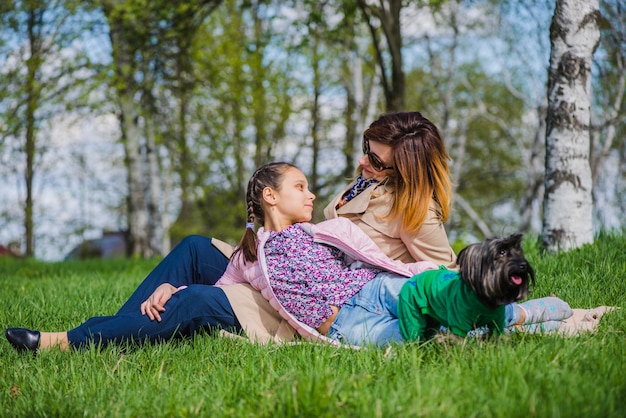 Mother and daughter looking at each other in the park