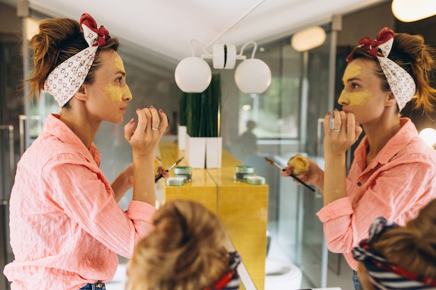 Mother and daughter making masks home