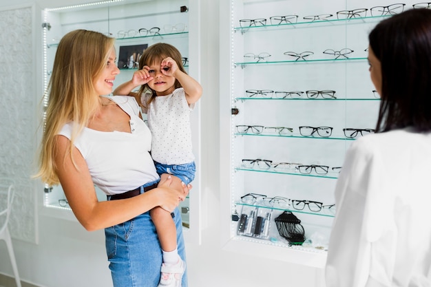 Mother and daughter at optician shop