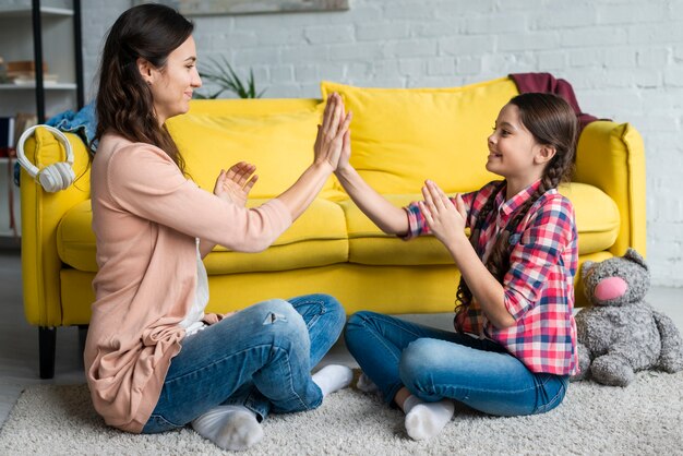 Mother and daughter playing and having fun