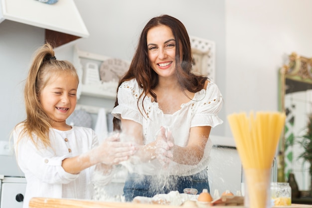 Mother and daughter playing with dough