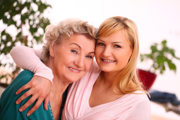 mother and daughter posing