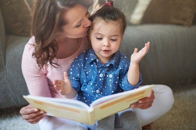 Mother and daughter reading a book