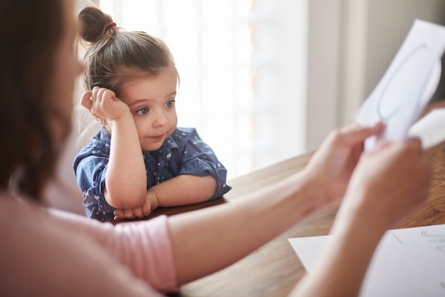 Mother and daughter reading a book