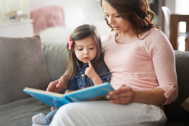 Mother and daughter reading a book