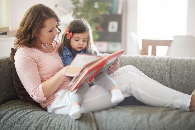 Mother and daughter reading a book