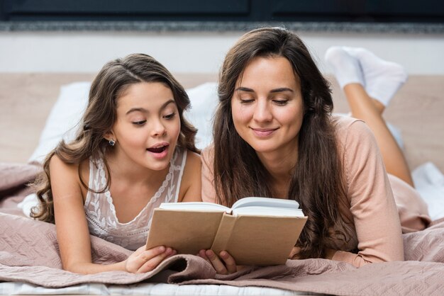 Mother and daughter reading together