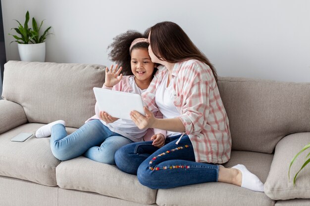 Mother and daughter relaxing at home