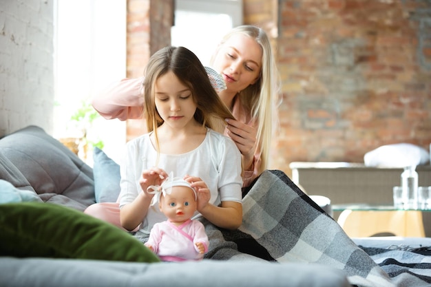 Mother and daughter, sisters have quite, beauty and fun day together at home