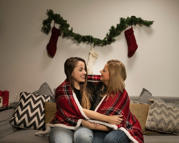 Mother and daughter smiling at each other