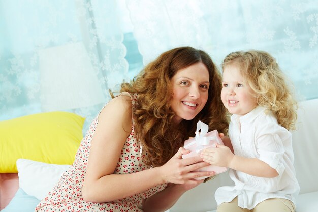 Mother and daughter smiling