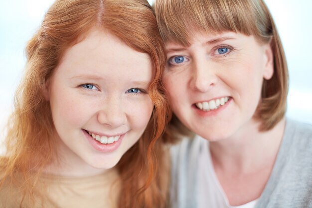 Mother and daughter smiling