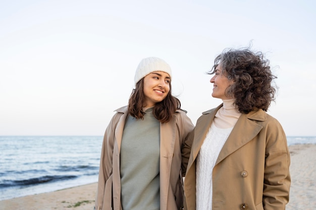 Mother and daughter spending time at the beach together