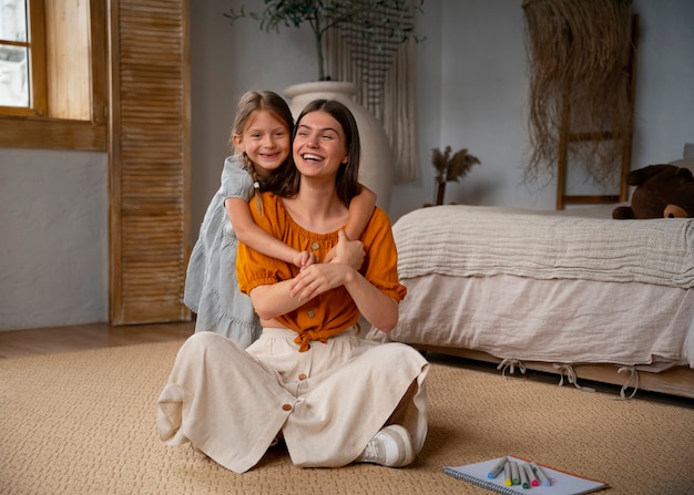 Free photo mother and daughter spending time together while wearing linen clothing