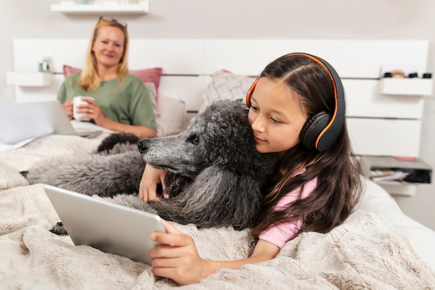 Mother and daughter spending time together with their dog