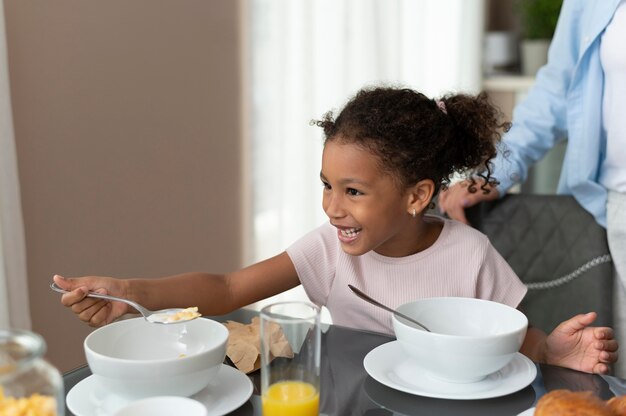 Mother and daughter staying in the kitchen