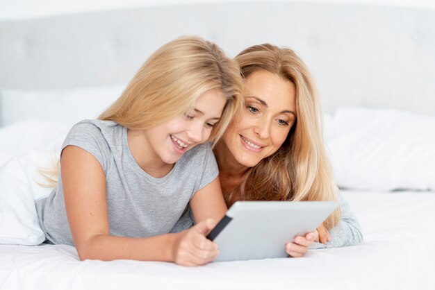 Mother and daughter  using tablet