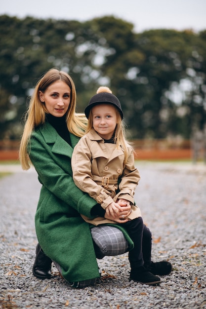 Mother and daughter walking around the stable