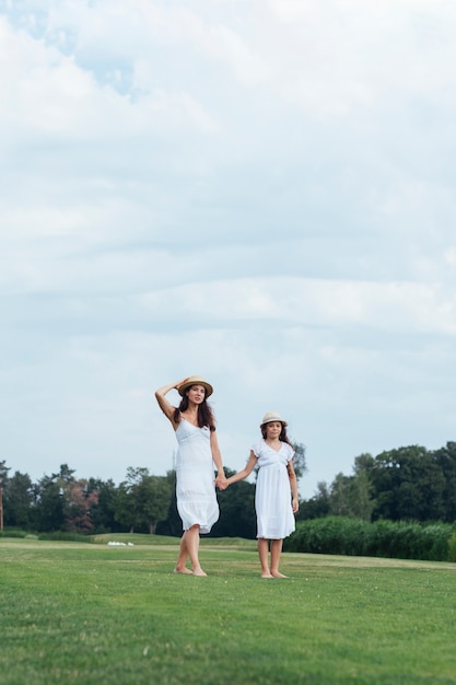 Mother and daughter walking outdoors