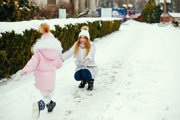 Mother and daughter in a winter park