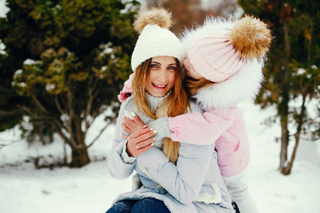 Mother and daughter in a winter park