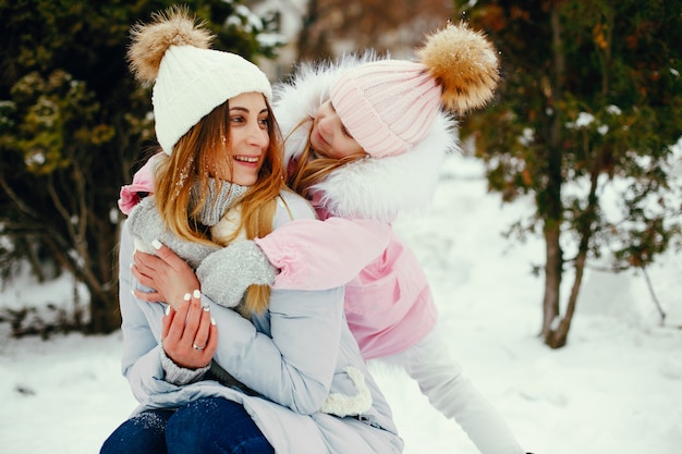 Mother and daughter in a winter park