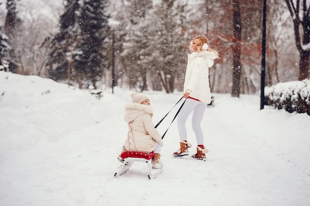 Mother and daughter in a winter park