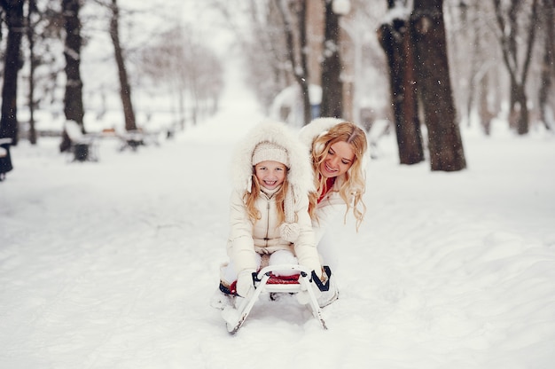 Mother and daughter in a winter park