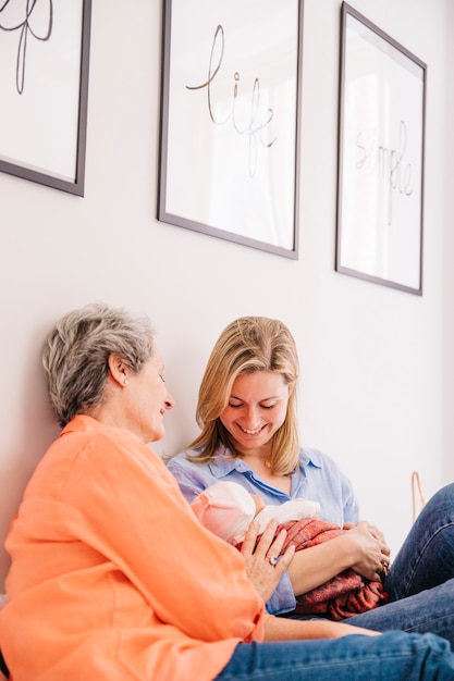 Free photo mother and daughter with baby