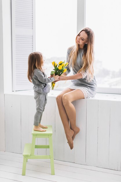 Mother and daughter with flowers