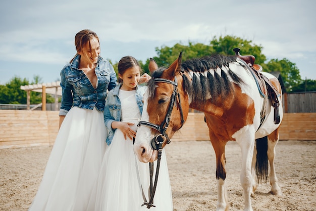 mother and daughter with hourse