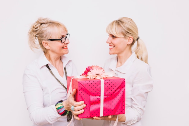 Mother and daughter with present