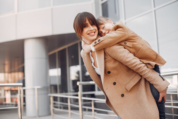 Mother and daughter with shopping bag in a city