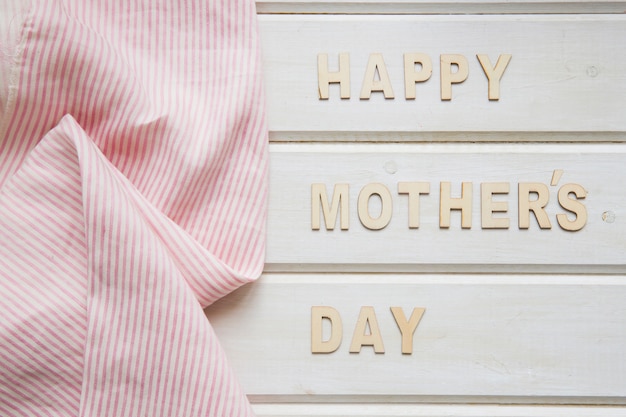 Free photo mother day composition with pink cloth