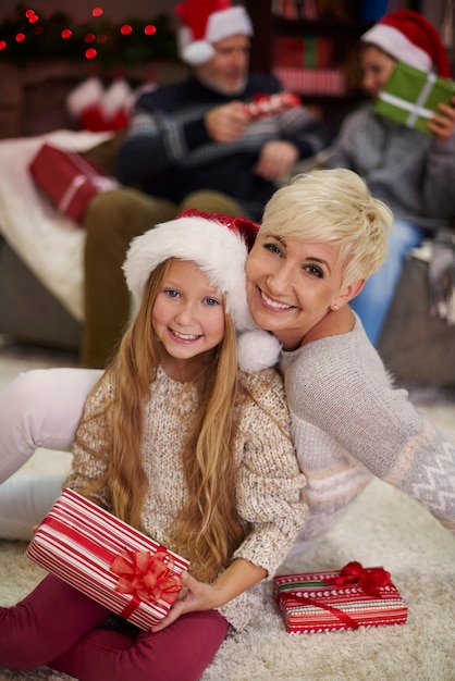 Mother embracing her daughter in the sitting room