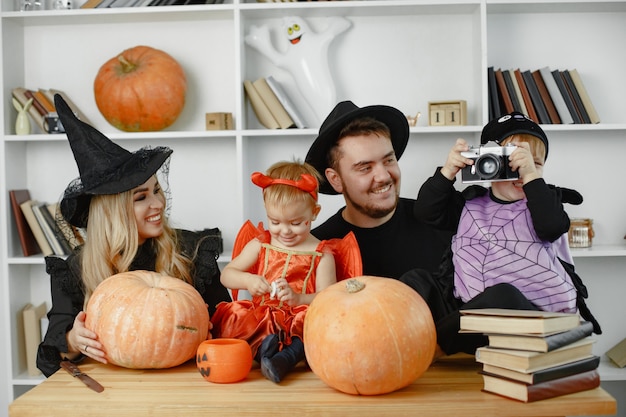 Mother father and children in costumes and makeup