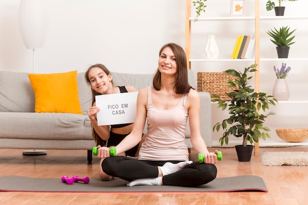 Mother and girl at home training