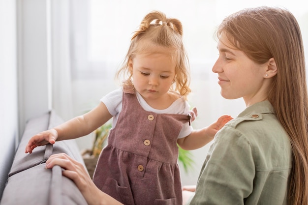 Mother and girl sitting together