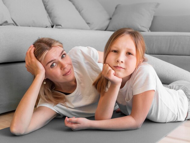 Mother and girl sport practice together