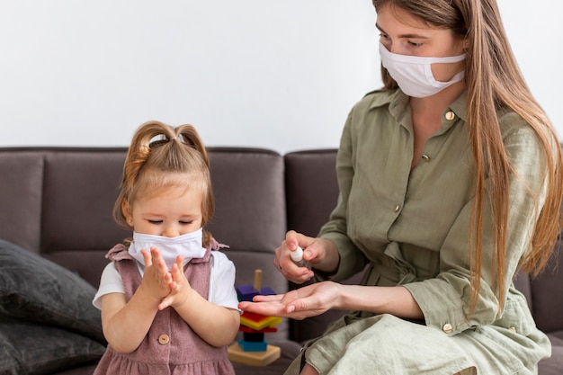 Mother and girl with masks