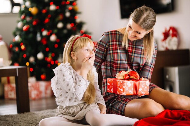 Mother giving present to daughter